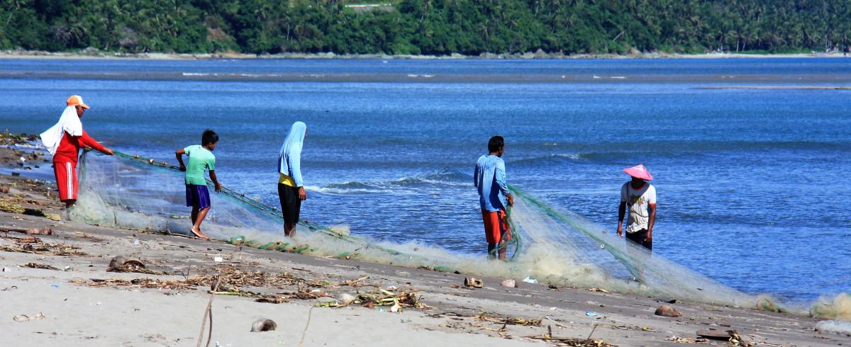 Hauling in a net in the Philippines