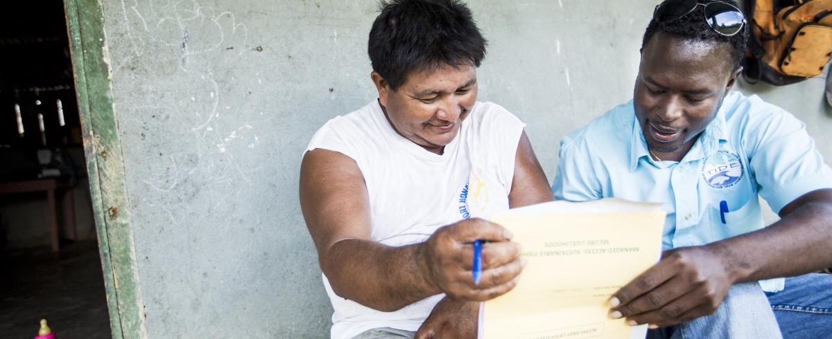 Reviewing catch logbook in Belize